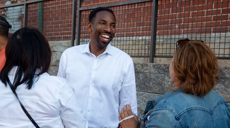Andre Dickens talks with supporters before formally announcing his bid for mayor at Monday Night Garage in Atlanta on May 20, 2021. STEVE SCHAEFER FOR THE ATLANTA JOURNAL-CONSTITUTION
