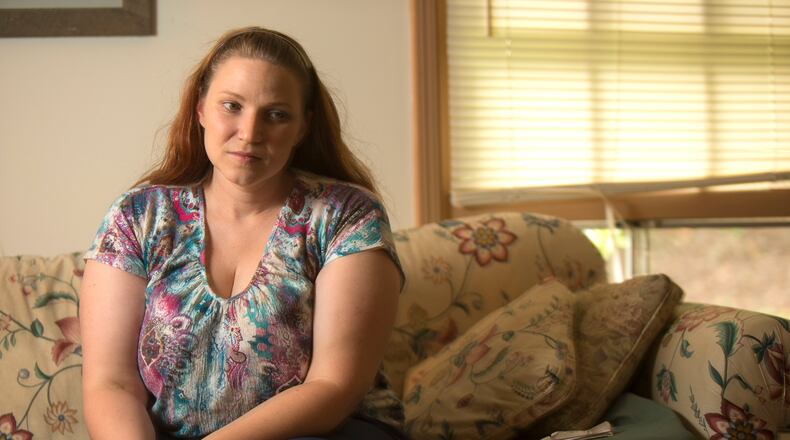 Meg Johnston at her home in Marietta on July 18: “I’m not a welfare queen. I don’t stay on the government dole. … But sometimes you’ve got to swallow your pride and ask for help. JASON GETZ / SPECIAL