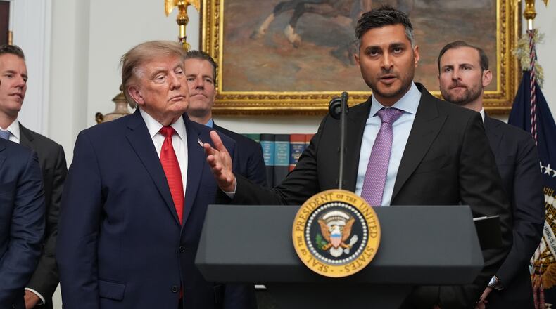 FILE - Kraken co-CEO Arjun Sethi speaks as President Donald Trump listens during a meeting with technology leaders in the Roosevelt Room of the White House, Aug. 19, 2026, in Washington. (AP Photo/Jacquelyn Martin, File)