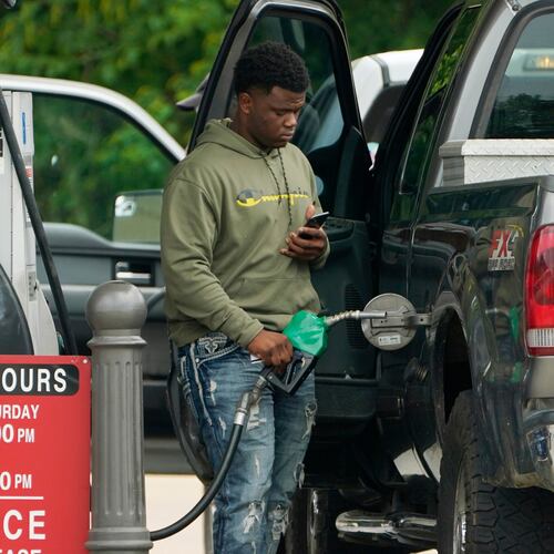 FILE - A customer prepares to pump diesel fuel at this Madison, Miss., Sam's Club, Tuesday, May 24, 2022. (AP Photo/Rogelio V. Solis, File)