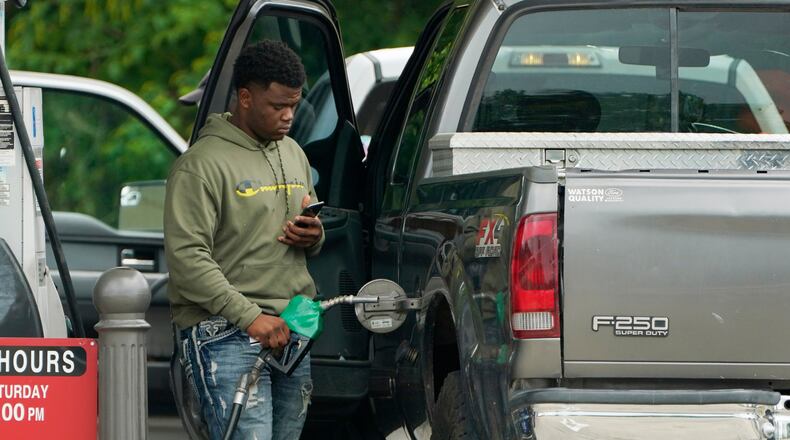 FILE - A customer prepares to pump diesel fuel at this Madison, Miss., Sam's Club, Tuesday, May 24, 2022. (AP Photo/Rogelio V. Solis, File)