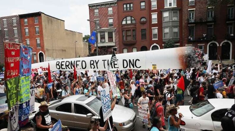 Bernie Sanders supporters are joined by other groups as they march towards FDR Park on the first day of the Democratic National Convention, Monday. (Spencer Platt / Getty Images)