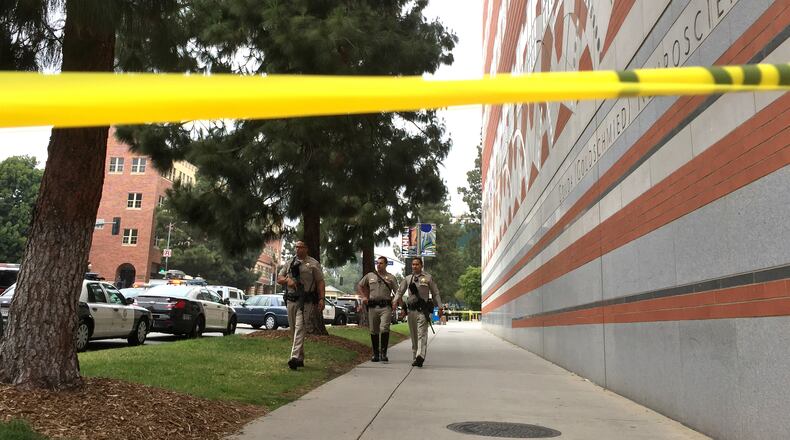 Sheriff deputies work at the scene of a fatal shooting at the University of California, Los Angeles, Wednesday, June 1, 2016, in Los Angeles. (AP Photo/Ringo H.W. Chiu)
