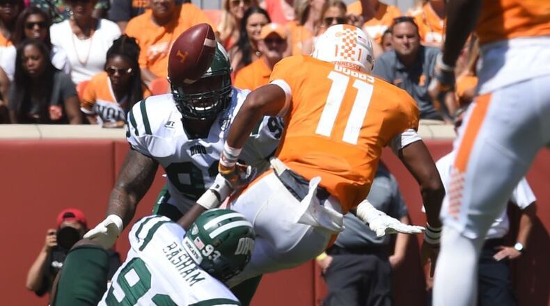 Ohio defensive lineman Tarell Basham (93) trips up Tennessee quarterback Joshua Dobbs (11) causing a fumble during the first half at Neyland Stadium on Saturday, Sept. 17, 2016. (AMY SMOTHERMAN BURGESS/NEWS SENTINEL)