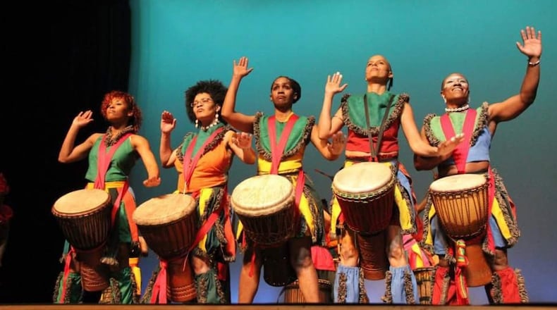 The love of what they do propels members of Giwayen Mata, shown preparing for the 20th Anniversary Concert Celebration. Now, the all-female African drum, dance and vocal ensemble is marking 25 years. CONTRIBUTED BY GIWAYEN MATA