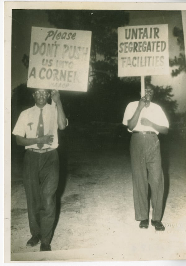 W. W. Law, left, and Dezzie Riley picket segregated Grayson Stadium during the civil rights movement. The protests led the owner of a minor league team to relocated from Savannah to Virginia during the 1962 season. (Courtesy of City of Savannah Municipal Archives)