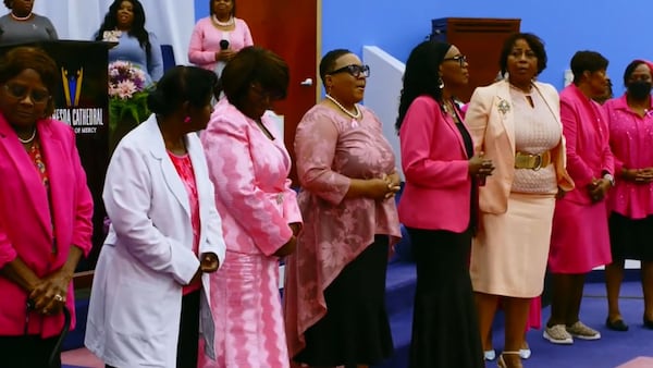 During Breast Cancer Awareness Month in October, JoAnna Zackery’s church brought survivors of cancer to the altar. Zackery, center, a uterine cancer survivor, went into remission in 2024. (YouTube)