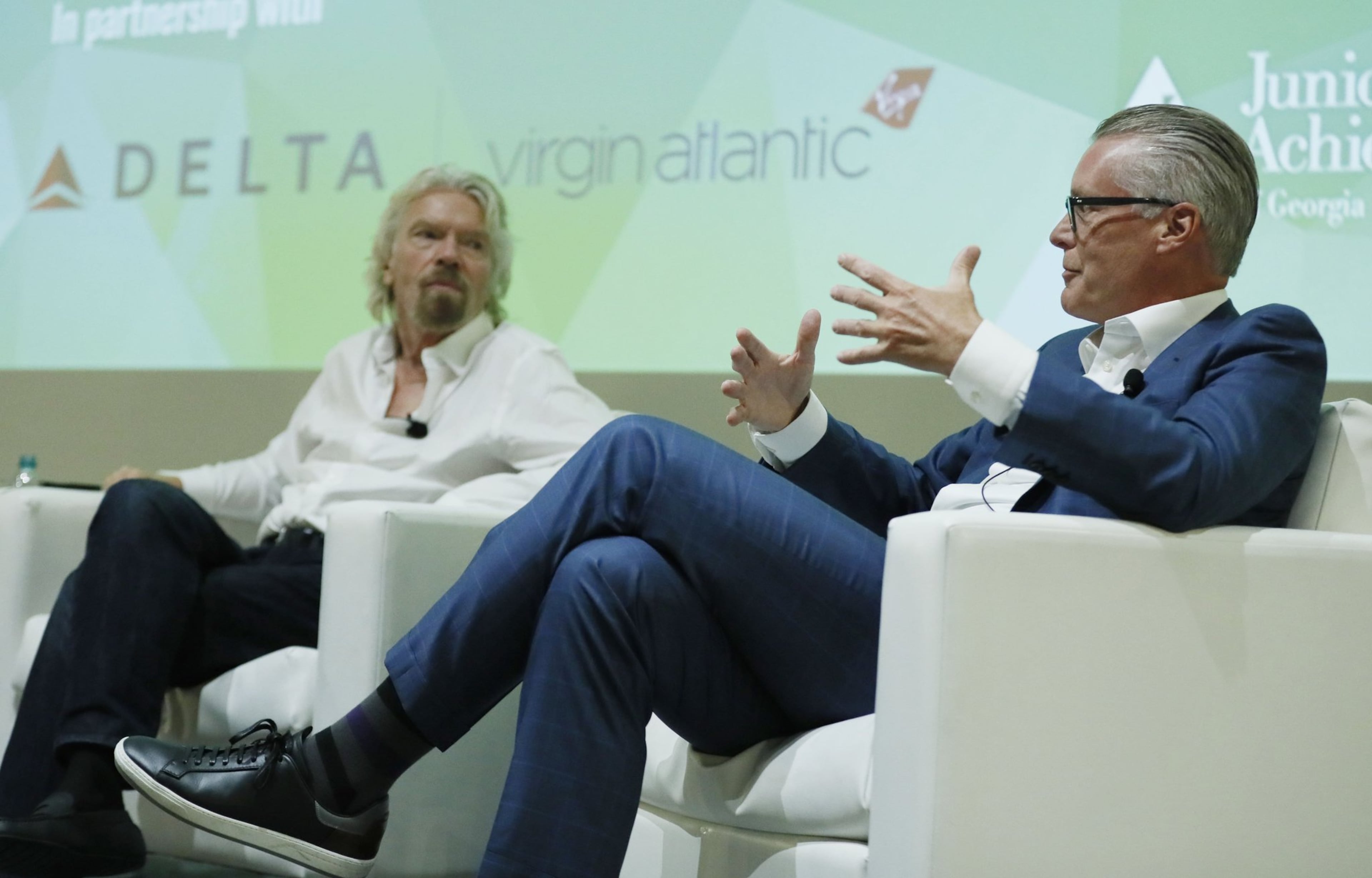 Delta CEO Ed Bastian (right) and Virgin founder Richard Branson held a “fireside chat” event at the Georgia World Congress Center where they discussed the partnership between Delta and Virgin Atlantic and their goal of transforming the customer experience. (Bob Andres/AJC)
