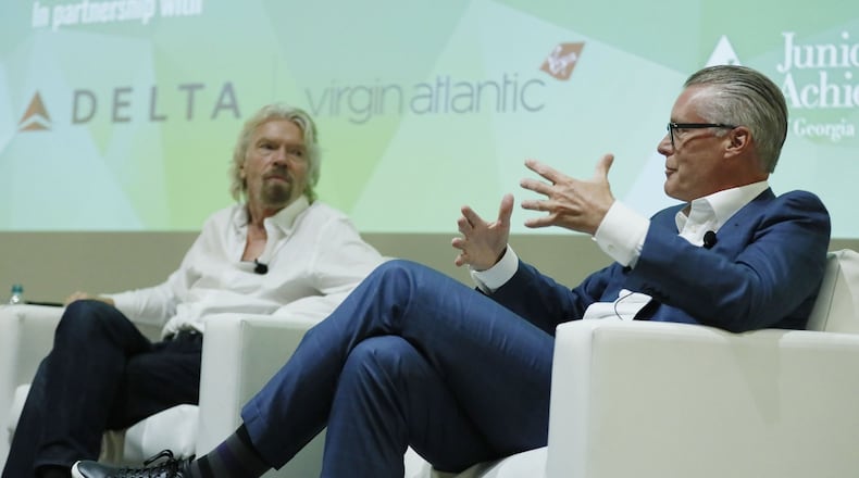 Delta CEO Ed Bastian (right) and Virgin founder Richard Branson held a “fireside chat” event at the GWCC where they discussed the partnership between Delta and Virgin Atlantic and their goal of transforming the customer experience. BOB ANDRES /BANDRES@AJC.COM