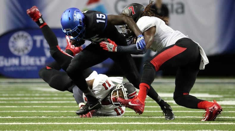 Georgia State receiver Todd Boyd (15) carries the ball against Ball State defenders Josh Miller (11) and Aaron Taylor (7) during the third quarter of their game at the Georgia Dome, Friday, September, 2016, in Atlanta, Ga. PHOTO / JASON GETZ