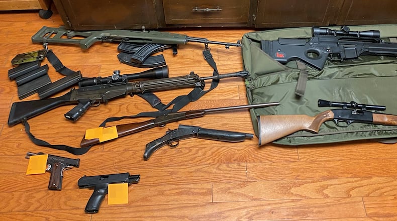 Guns recovered by the Cherokee County Sheriff's Office after a drug bust at a Woodstock home Friday morning led to the arrest of all seven residents.