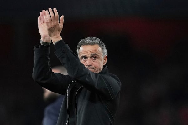 PSG's head coach Luis Enrique applauds the fans at the end of the Champions League semifinal first leg soccer match between Arsenal and Paris Saint-Germain at Arsenal Stadium in London, England, Tuesday, April 29, 2025. (AP Photo/Kin Cheung)