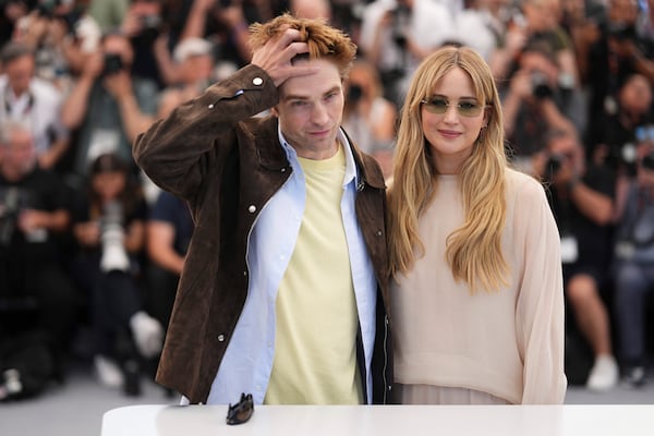 Robert Pattinson, left, and Jennifer Lawrence pose for photographers at the photo call for the film 'Die, My Love' at the 78th international film festival, Cannes, southern France, Sunday, May 18, 2025. (Photo by Scott A Garfitt/Invision/AP)