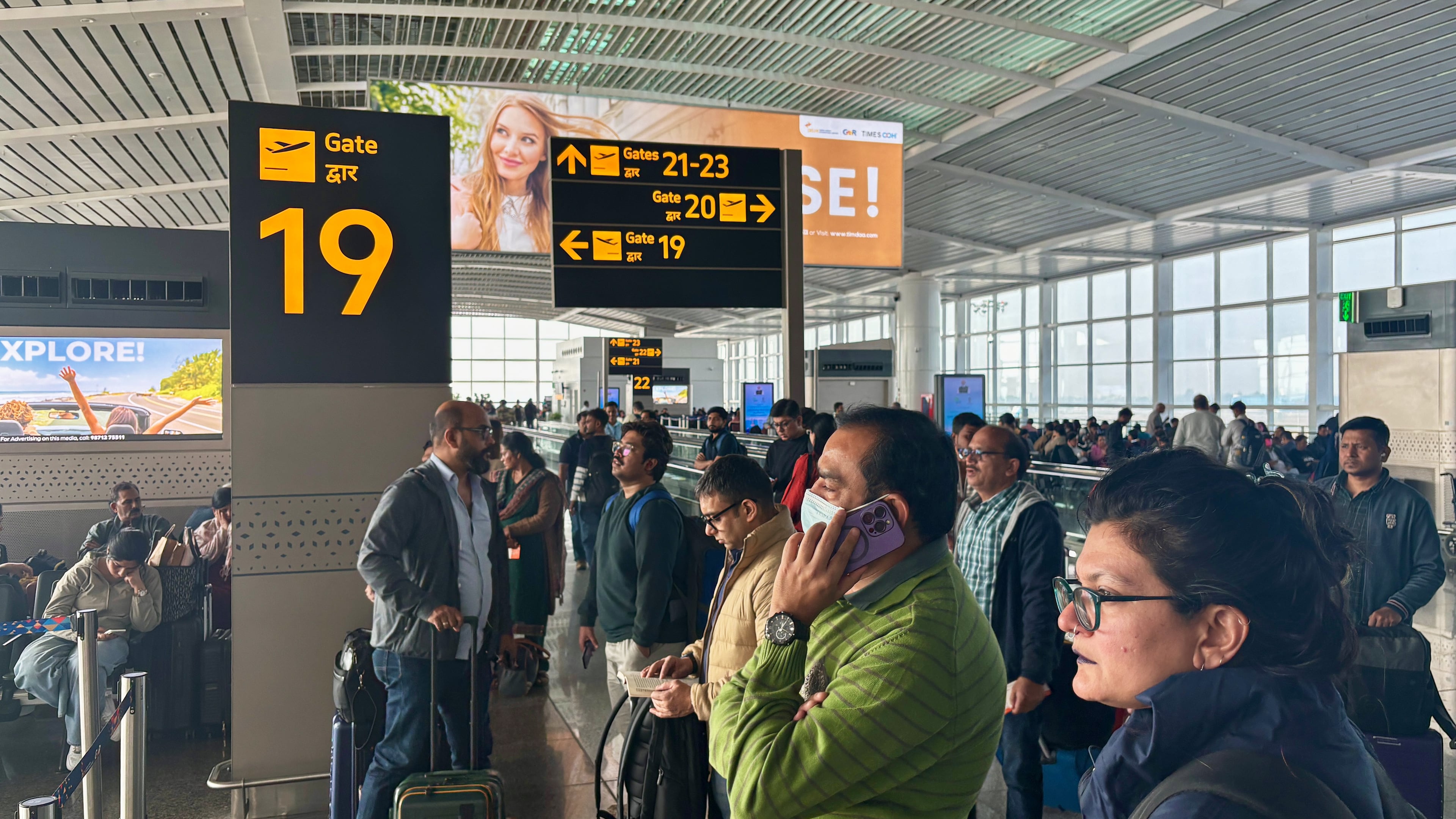 Passengers wait outside the Indira Gandhi International Airport in New Delhi, India, as several Indigo Airlines flights were either cancelled or delayed, Thursday, Dec. 4, 2025. (AP Photo/Manish Swarup)