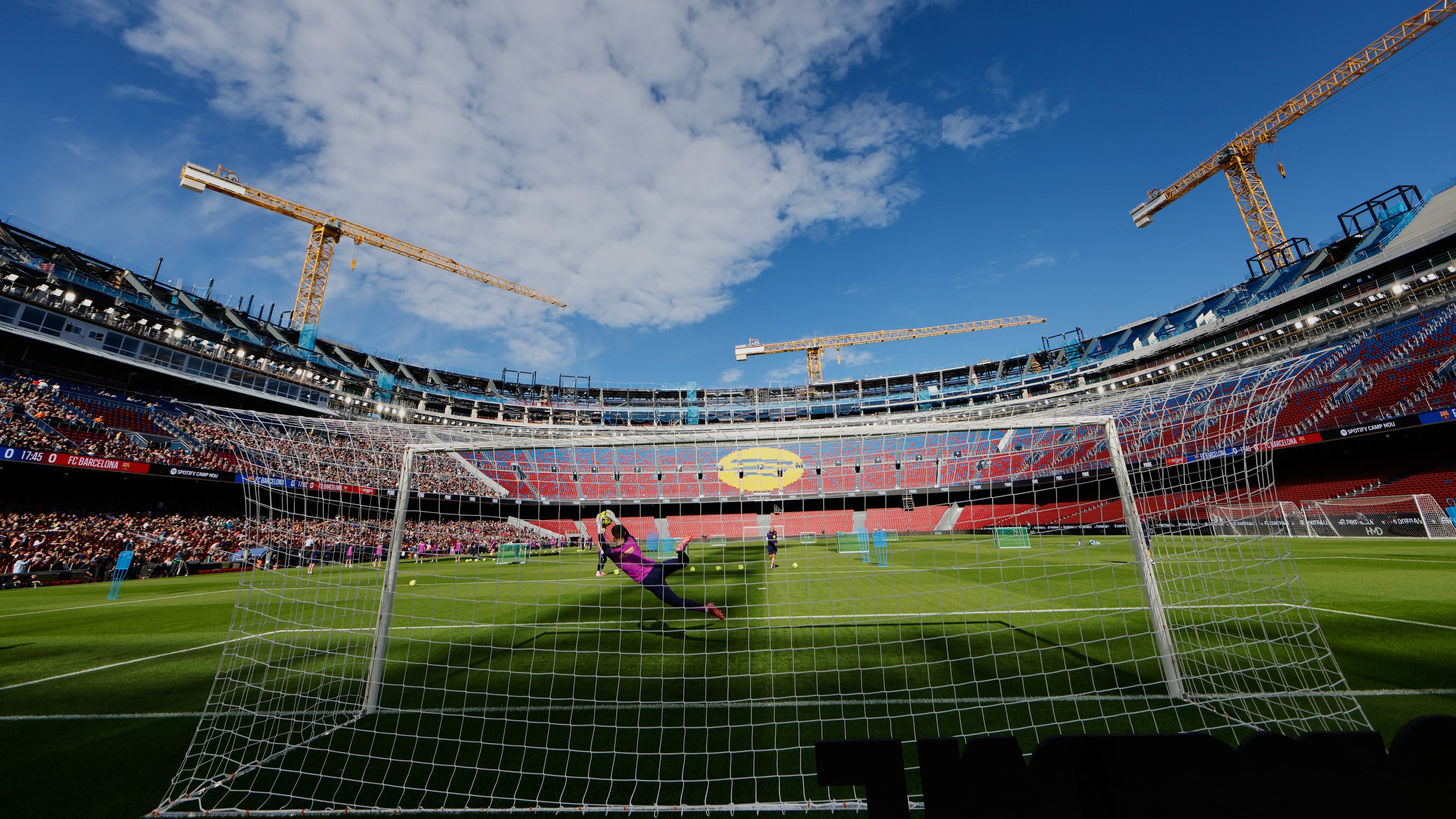 Barcelona's players exercise during the team's first training session at the venue after its renovation at the Camp Nou stadium in Barcelona, Spain, Friday, Nov. 7, 2025. (AP Photo/Joan Monfort)