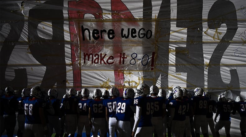 Walton players prepare to take the field against Roswell Friday, Oct. 19, 2018 in Marietta.