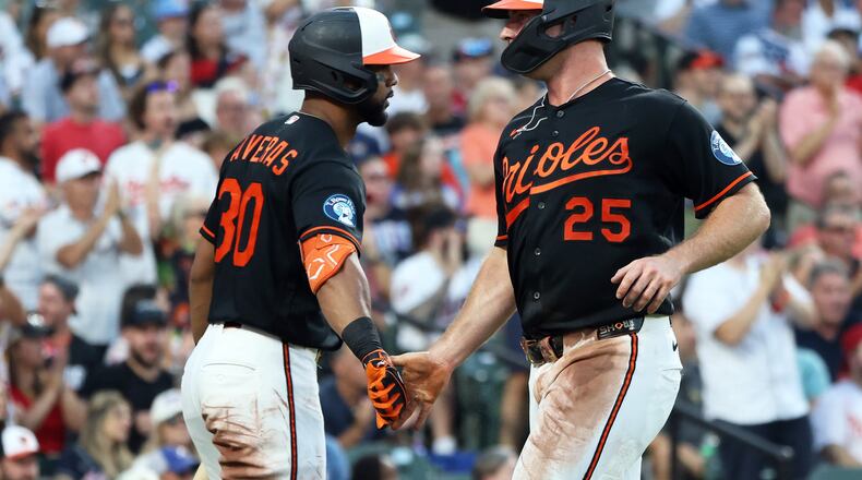 Baltimore Orioles' Pete Alonso celebrates with Baltimore Orioles' Leody Taveras after scoring a run during the third inning of a baseball game against the Atlanta Braves, Saturday, July 25, 2026, in Baltimore. (AP Photo/Daniel Kucin Jr.)