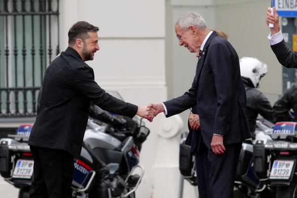 Ukraine's President Volodymyr Zelenskyy, left, and Austrian President Alexander van Der Bellen shake hands in Vienna, Austria, Monday, June 16, 2025. (AP Photo/Heinz-Peter Bader)