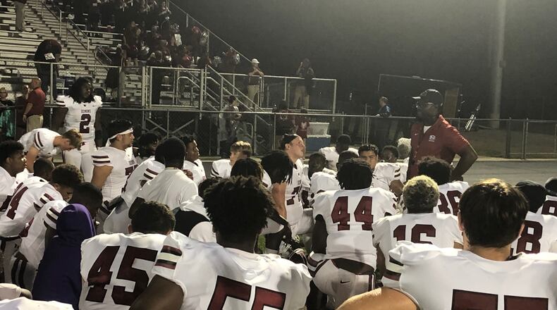 Warner Robins coach Marquis Westbrook talks to his team after its 50-34 win over Archer on Aug. 27, 2021.