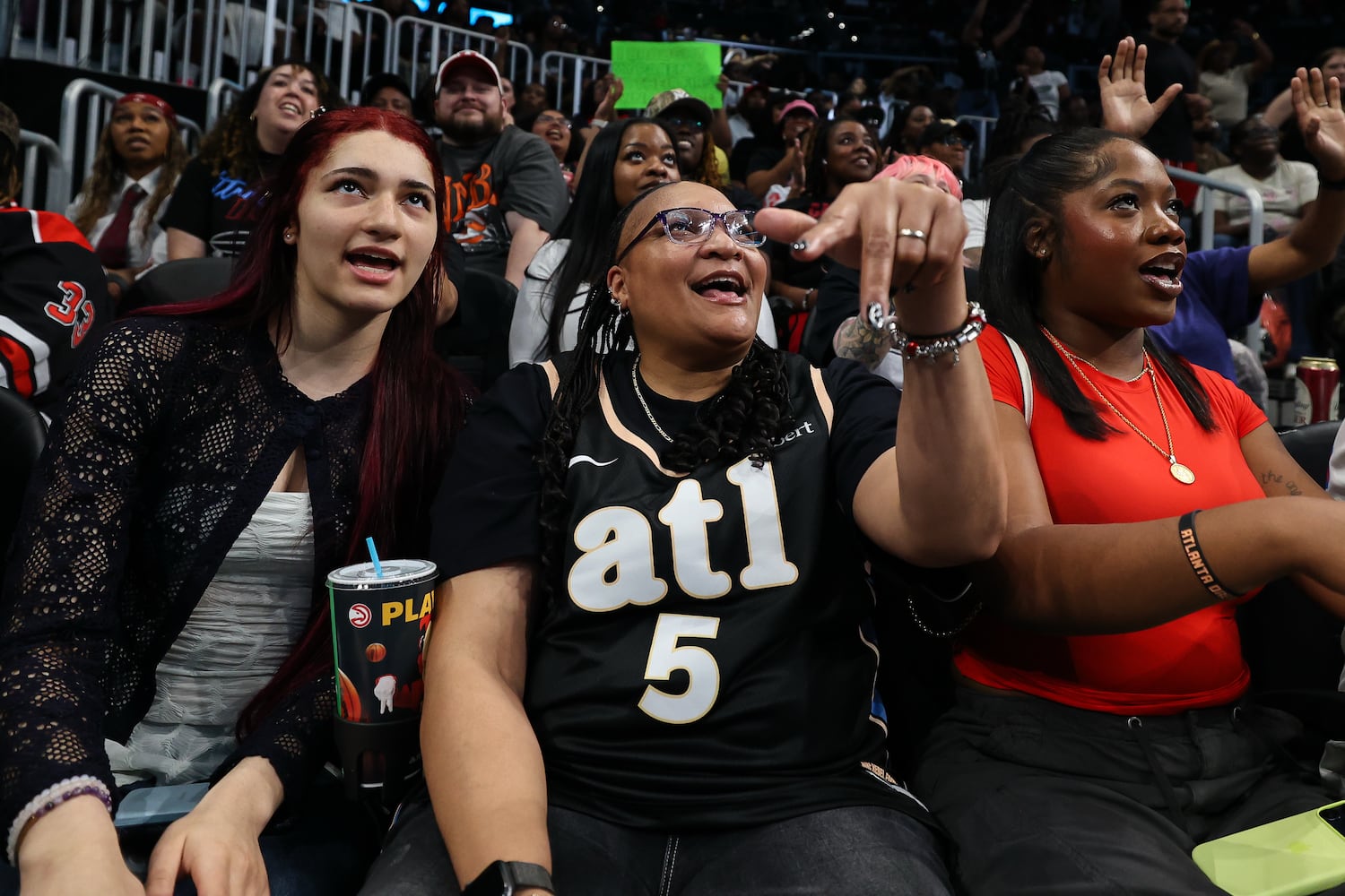Fans react during the second half of a WNBA game between the Atlanta Dream and Las Vegas Aces at State Farm Arena on Sunday, May 17, 2026, in Atlanta. (Colin Hubbard for the AJC) 