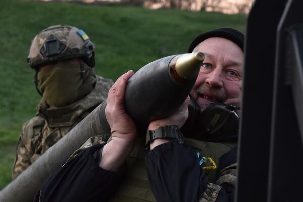 In this photo provided by Ukraine's 65th Mechanised Brigade press service, Ukrainian servicemen prepare to fire a multiple launch rocket system based on a pickup truck in the Zaporizhzhia region, Ukraine, Tuesday, April 8, 2025, (Andriy Andriyenko/Ukraine's 65th Mechanised Brigade via AP)