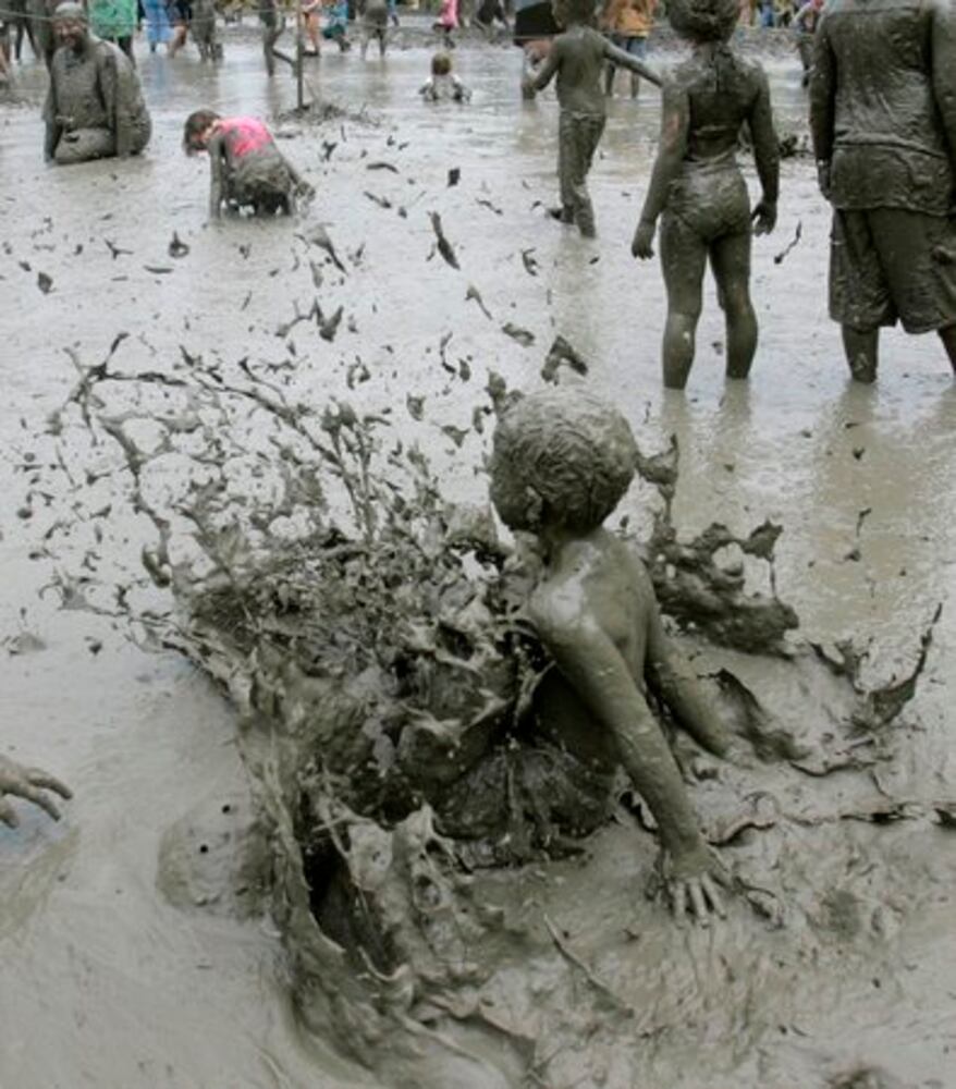 Dream day: Kids frolick in muddy goo