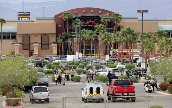 Las Vegas Metro Police officers are shown in front of a Las Vegas Athletic Club after a shooting Friday, May 16, 2025, in Las Vegas. (Steve Marcus/Las Vegas Sun via AP)