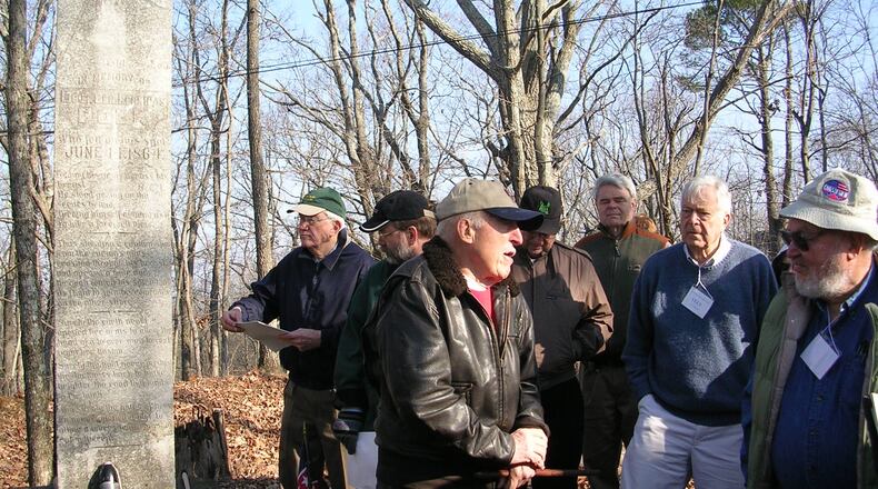 In this 2006 photo, Civil War enthusiasts gather at the monument erected to the memory of Confederate Major Gen. Leonidas Polk, killed near Marietta 152 years ago. The historically significant site is held privately. Historians fear that a rebound in development may imperil other privately owned Civil War sites in the metro area and across Georgia.