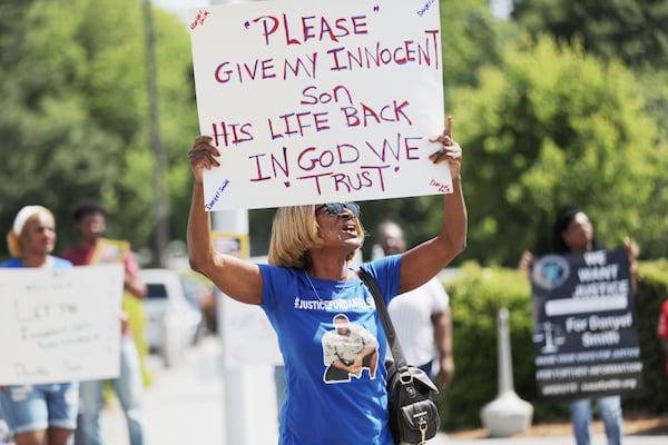 Helen Smith, the mother of Danyel Smith, holds a sign during the "Justice for Danyel Smith" rally outside of the Gwinnett Justice Administration Center on Thursday, May 5, 2022. Smith, who in 2003 was convicted of shaking his baby to death. A request for a new trial is pending before the Georgia Supreme Court. (Miguel Martinez/AJC)