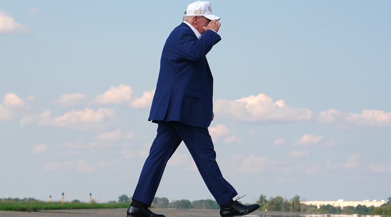President Donald Trump walks to board Air Force One at Morristown Airport, Sunday, Aug. 9, 2026, in Morristown, N.J. (AP Photo/Julia Demaree Nikhinson)