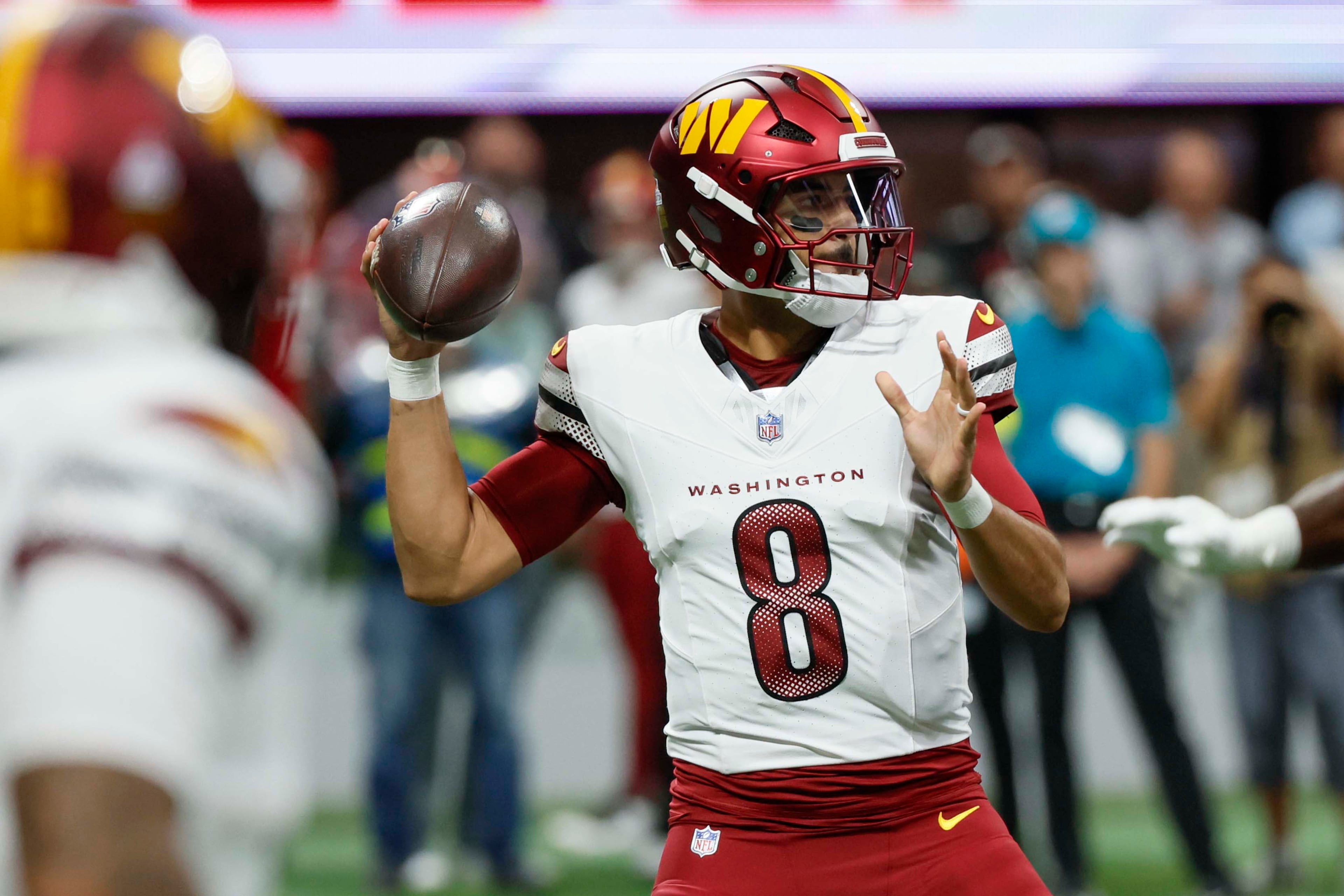 Washington Commanders quarterback Marcus Mariota attempts a pass during the first half of an NFL game against the Washington Commanders at Mercedes-Benz Stadium in Atlanta on Sunday, September 28, 2025. (Miguel Martinez/AJC)