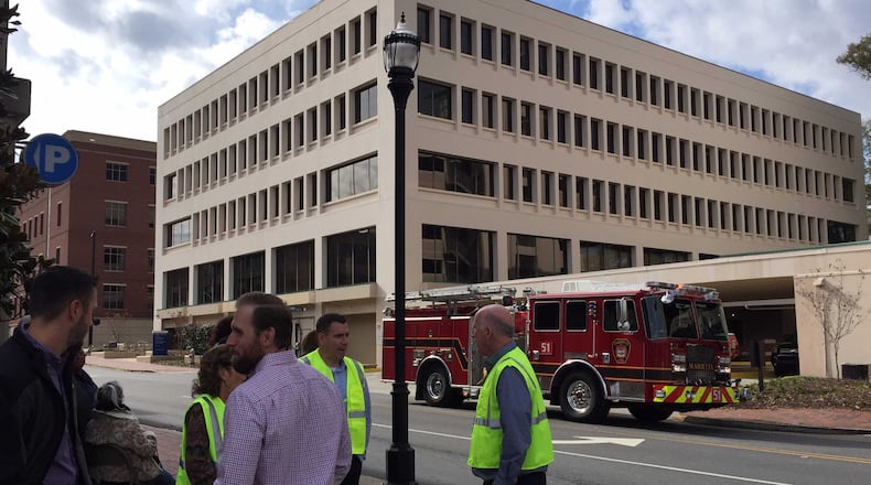 The Cobb County Government building at 100 Cherokee St. was evacuated Tuesday, after a fire started from holiday decorations accidentally lit a blaze, the county said.