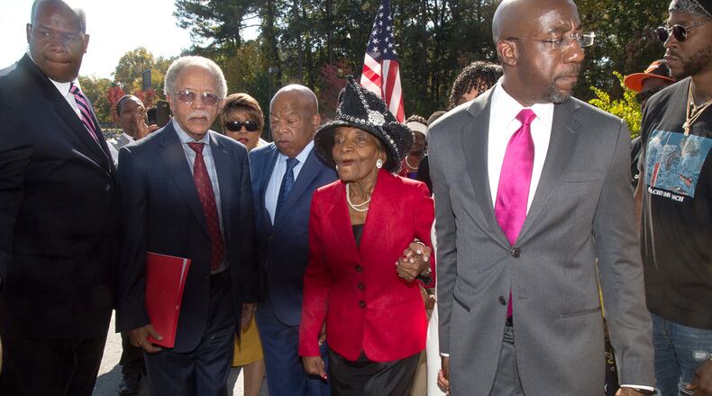 Rev. Raphael Warnock, Senior Pastor of Ebenezer Baptist Church (R) along with other dignitaries walk into the Adamsville Recreational Center to vote Sunday in Atlanta, GA, October 30, 2016. STEVE SCHAEFER / SPECIAL TO THE AJC