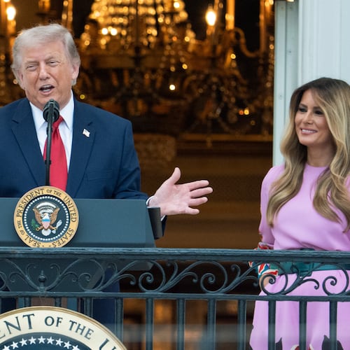 President Donald Trump with first lady Melania Trump addresses the attendees from the Blue Room Balcony of the White House during the annual Congressional Picnic on the South Lawn, Tuesday, May 19, 2026, in Washington. (AP Photo/Manuel Balce Ceneta)
