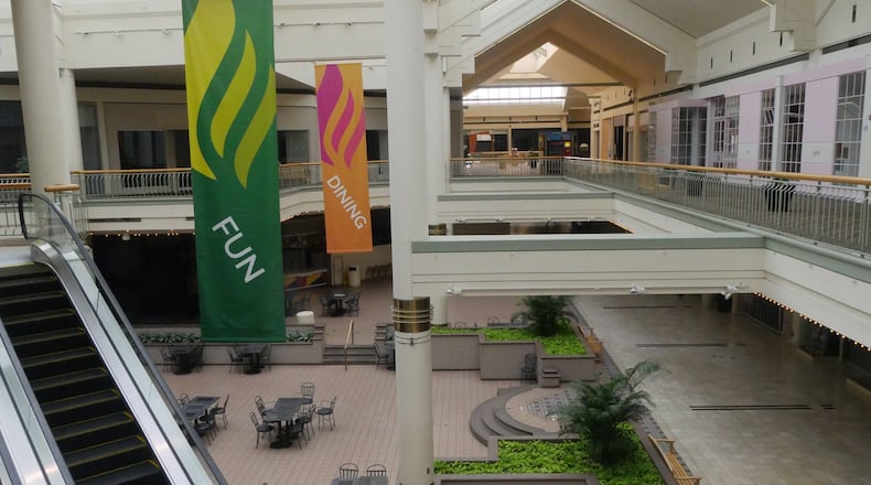 Gwinnett Place mall once heralded Gwinnett’s arrival as a growing economic power. Now, the Duluth mall has few shoppers and stores, and there were no businesses in the food court on a recent visit. A woman’s body was found days before Christmas in a back room of a vacant Subway shop in the food court. HYOSUB SHIN / HSHIN@AJC.COM