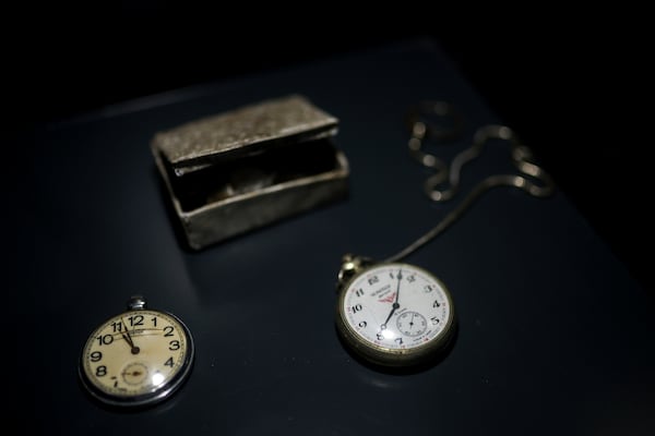 Pocket watches found in a mass grave are shown as a part of the exhibition "Lives Beyond the Fields of Death" opened at the Srebrenica Memorial Center in Potocari, Bosnia, Thursday, July 10, 2025. (AP Photo/Armin Durgut)