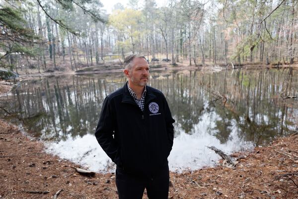 Atlanta Park and Recreation Commissioner Justin Cutler stands beside a lake as he speaks about the recent acquisition of Tatum Lakes urban forest, which will be transformed into a publicly accessible park in southwest Atlanta on Thursday, March 19, 2026. The park, set to be open to the public, will be finished in 2027. (Miguel Martinez/AJC)