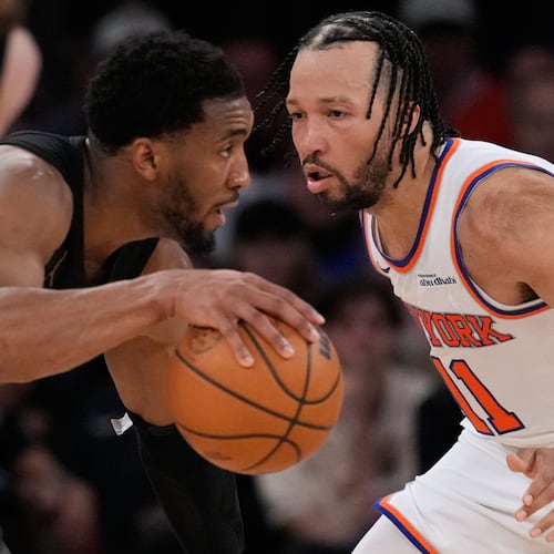 New York Knicks' Jalen Brunson, right, covers Cleveland Cavaliers' Donovan Mitchell, left, during the second half of Game 1 in the Eastern Conference finals NBA basketball playoffs series, Tuesday, May 19, 2026, in New York. (AP Photo/Seth Wenig)