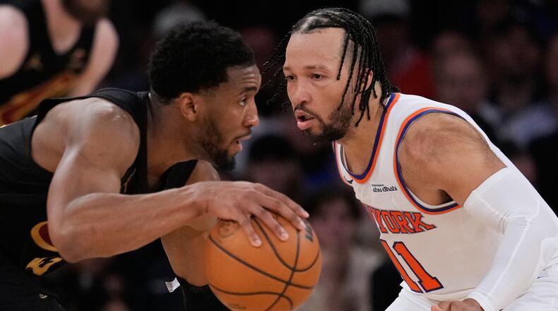 New York Knicks' Jalen Brunson, right, covers Cleveland Cavaliers' Donovan Mitchell, left, during the second half of Game 1 in the Eastern Conference finals NBA basketball playoffs series, Tuesday, May 19, 2026, in New York. (AP Photo/Seth Wenig)