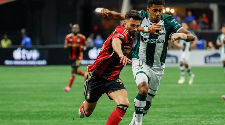 Atlanta United midfielder Pedro Amador (18) battles for posetion against Santos Laguna forward Antony Lozano (11) during the first half at Mercedes-Benz Stadium on Sunday, August 4, 2024, in Atlanta.
(Miguel Martinez/ AJC)