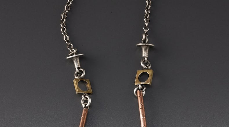 For the dog lover in you, Thomas Mann designed the convertible dogbox pin and necklace in his New Orleans gallery. CONTRIBUTED BY THOMASMANN.COM