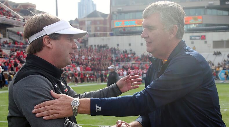 Georgia head coach Kirby Smart, left, speaks with Georgia Tech head coach Paul Johnson before the first half of an NCAA college football game, Saturday, Nov. 25, 2017, in Atlanta. (AP Photo/John Bazemore)