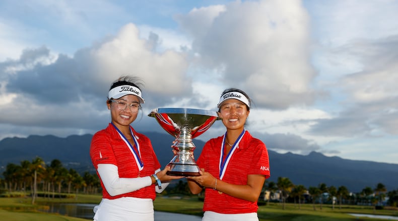 Thienna Huynh (left) and Sara Im pose with the trophy after winning the 2022 U.S. Women's Amateur Four-Ball on Sunday at Grand Reserve Golf Club in Rio Grande, Puerto Rico. (Chris Keane/USGA)