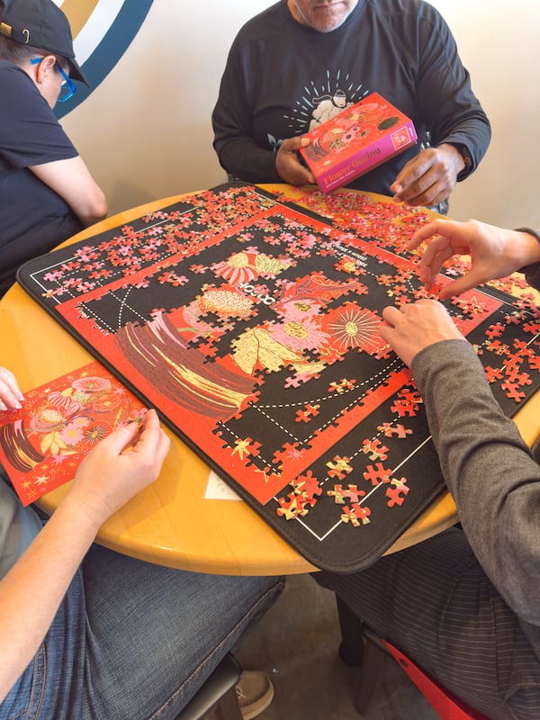 At Red’s Beer Garden and other Atlanta spots, camaraderie is key during speed puzzling events. (Courtesy of Red’s Beer Garden)