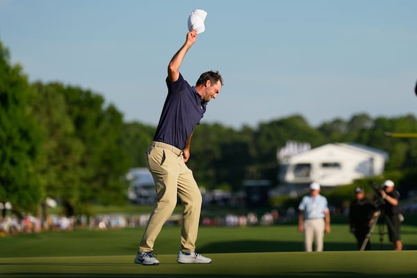 Scottie Scheffler celebrates after winning the PGA Championship golf tournament at the Quail Hollow Club, Sunday, May 18, 2025, in Charlotte, N.C. (AP Photo/George Walker IV)