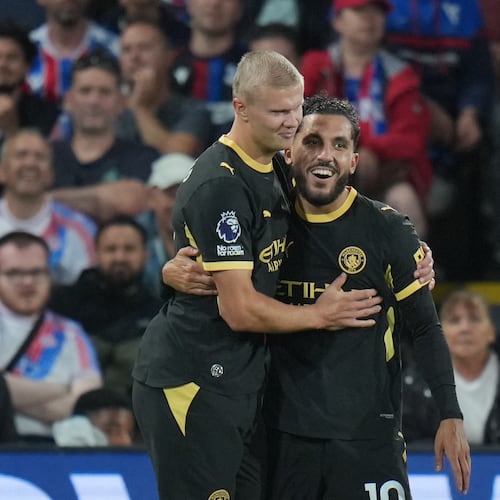 Manchester City's Rayan Cherki, right, celebrates with Erling Haaland after scoring his side's third goal during the English Premier League soccer match between Crystal Palace and Manchester City in London, Friday, Aug. 28, 2026. (AP Photo/Kin Cheung)