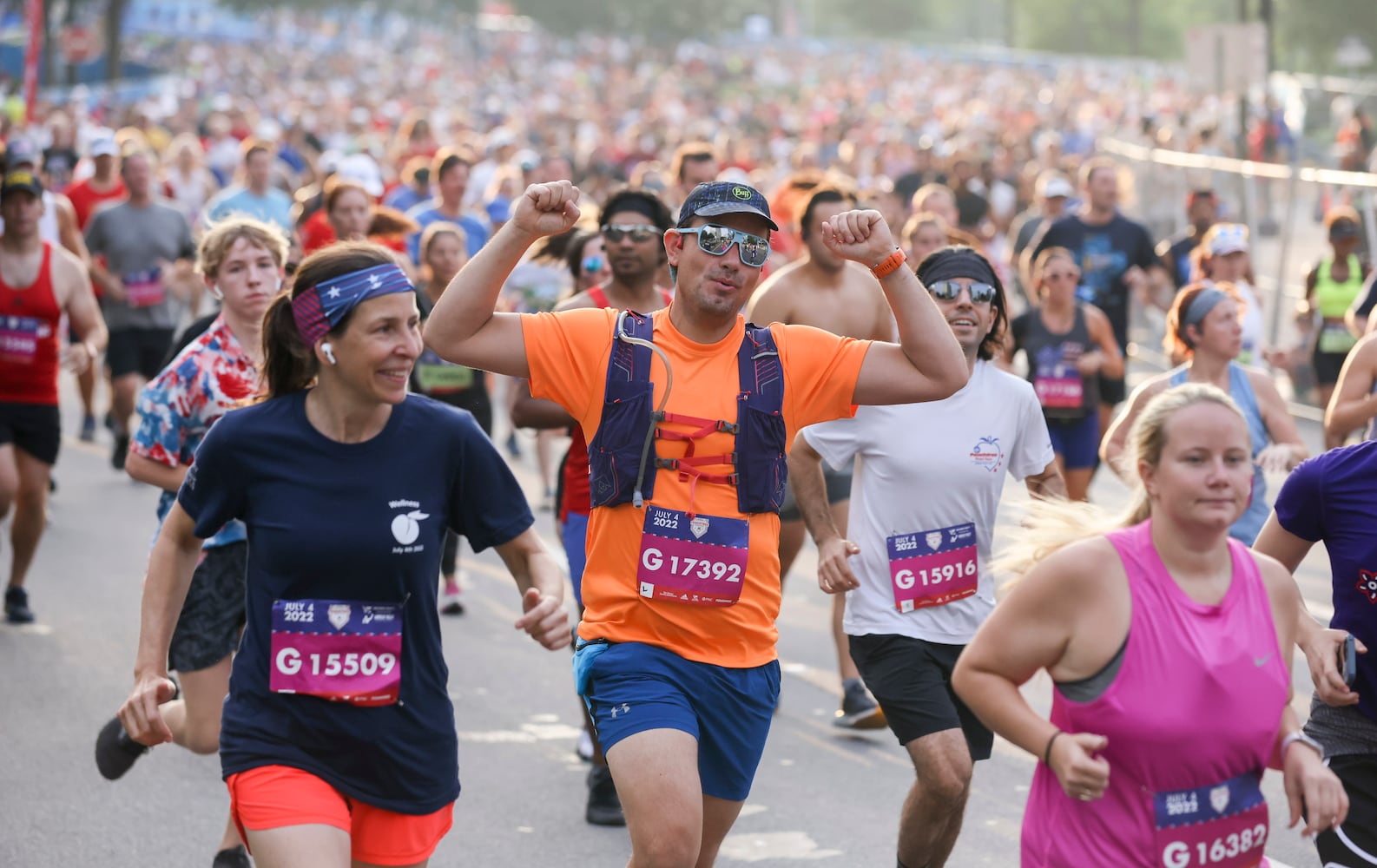 Runners take off at the start of the 53rd running of the Atlanta Journal-Constitution Peachtree Road Race in Atlanta on Monday, July 4, 2022. (Jason Getz / Jason.Getz@ajc.com)