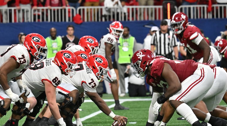 Georgia and Alabama line up at the line of scrimmage  during the second half in the SEC Championship game at Mercedes-Benz Stadium, December 2, 2023, in Atlanta. Alabama won 27-24 over Georgia. (Hyosub Shin / Hyosub.Shin@ajc.com)