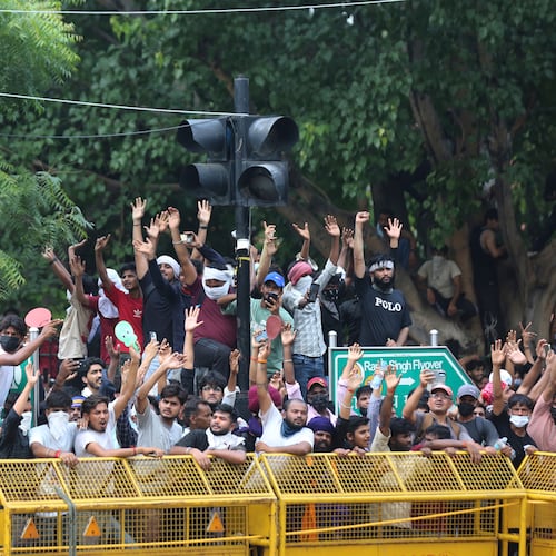 Protesters react after India's Education Minister Dharmendra Pradhan resigned following nationwide protests as part of the Cockroach Janta Party's protest movement in New Delhi, India, Saturday, July 25, 2026. (AP Photo/Vipin)