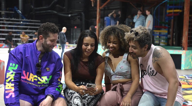 Sharing a moment during rehearsals are Kameron Lopreore (from left) and Amanda Batista, who sing the roles of Rodolfo and Mimi in "La Boheme," and Chani Maisonet and Heath Saunders, their counterparts in "Rent."
Courtesy of The Atlanta Opera Film Studio